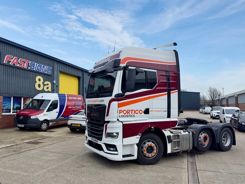An image of an 18 wheeler and van wrap for Portico Logistics.